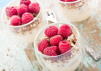 Yogurt with muesli and fresh raspberries