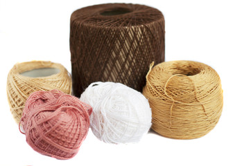 colorful tangles of thread for knitting on a white background