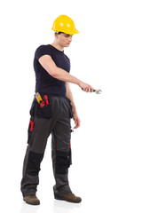 Manual worker using a wrench