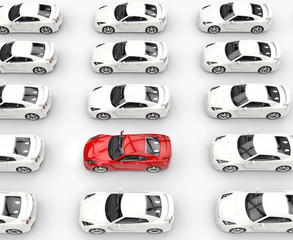 Red car among many rows of white cars