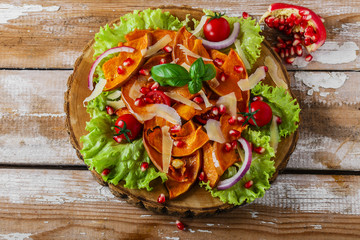 salad of roasted pumpkin and pomegranate cherry tomatoes