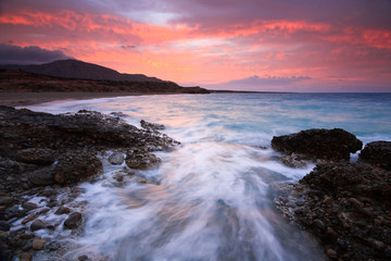 Winter sunset over a rough sea in Crete, Greece.
