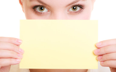 Ad. Businesswoman covering face with blank card