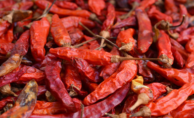 Dried red chillies as a textured food background.