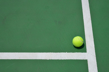 tennis ball on green court