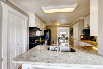 Kitchen cabinet with granite top and steel sink