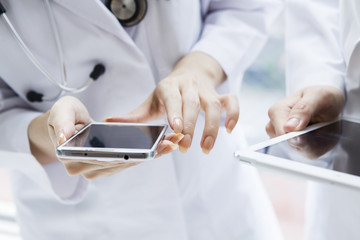Hand of the doctor to show the mobile terminal