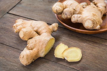 Ginger root sliced on wooden table