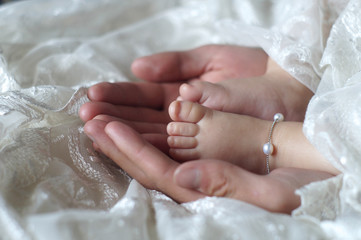 Baby feet in fother's hands