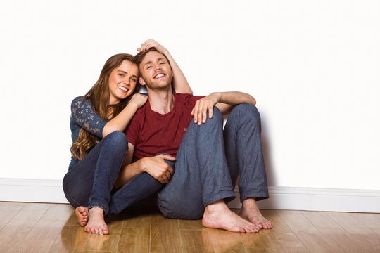 Young couple sitting on floor