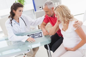 Fototapeta premium Doctor and nervous patient examining ultrasound