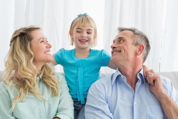 Happy family relaxing on the couch