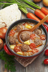 Cabbage soup with meatballs and tomatoes