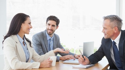 Business people all brainstorming together