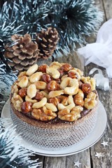 Christmas cake with caramelized nuts,chocolate and spices.