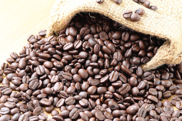 Coffee beans placed on bag sack.