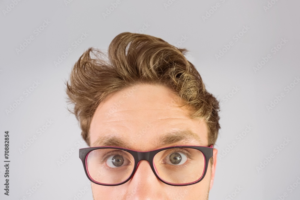 Poster geeky businessman looking at camera