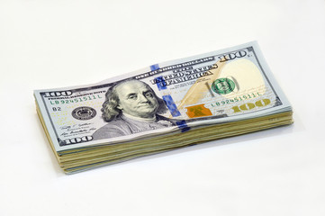 one hundred dollar bill closeup on white background