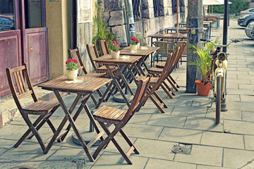 In the morning old outdoor cafes waiting for visitors