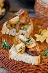 Fried cepes with bacon, garlic and rosemary