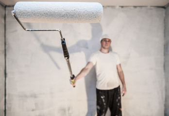 Man Holding Roller Pin