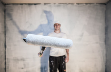 Closeup of Man Holding Roller Pin