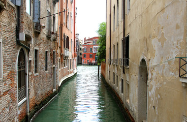 Fototapeta na wymiar narrow navigable canal in Venice in Italy