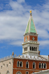 Fototapeta na wymiar Bell Tower of St. Mark and blue sky and Ducal Palace