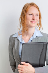 Smiling Businesswoman Holding a Folder