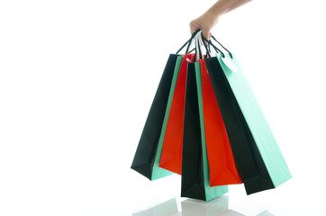 Fototapeta na wymiar Woman hand holding shopping bag on white background