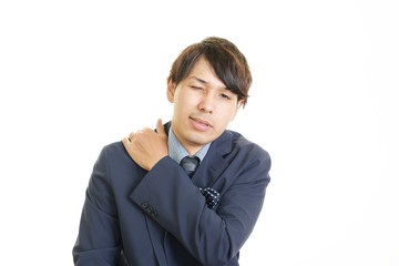 肩痛を訴えるビジネスマン