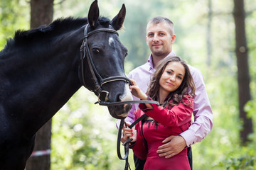 Obraz premium happy couple and horse