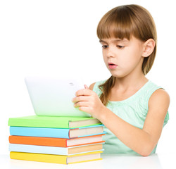 Young girl is using tablet