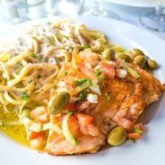 close-up of plate of pasta and smoked salmon