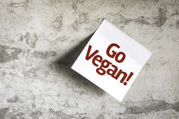 Go Vegan on Paper Note on texture background