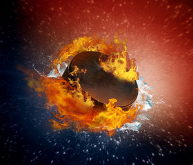 Burning puck with shards of ice on abstract background