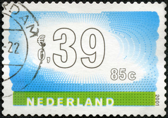 Stamp of the Netherlands with an abstract, colour background