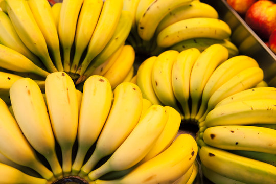 Group of bananas at market.
