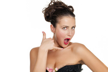 young woman making a call me gesture