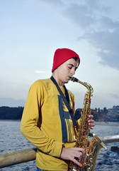 modern musician posing with his saxophone