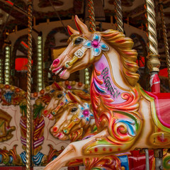 Colourful carousel horses © parkerspics