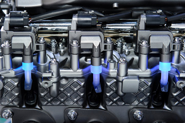 Fragment of the metal and chrome parts of automobile engine
