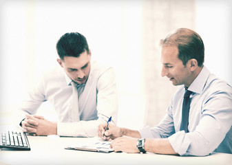 businessmen with notebook on meeting