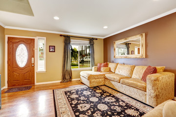Living room with comfortable creamy tone sofa