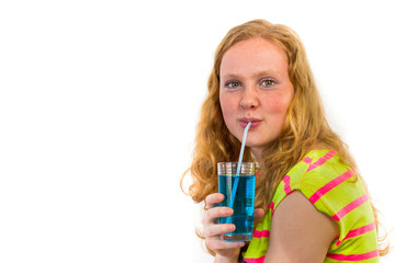 Redhead girl drinking soft drink