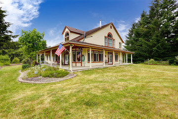 Fototapeta na wymiar American farm house exterior with large land