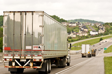 Obraz premium Heavy Truck Traffic Near Residential Neighborhood