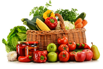 Wicker  basket with groceries isolated on white