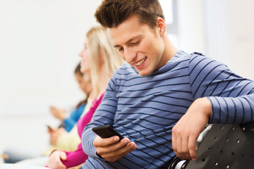 Fototapeta premium group of smiling students in lecture hall