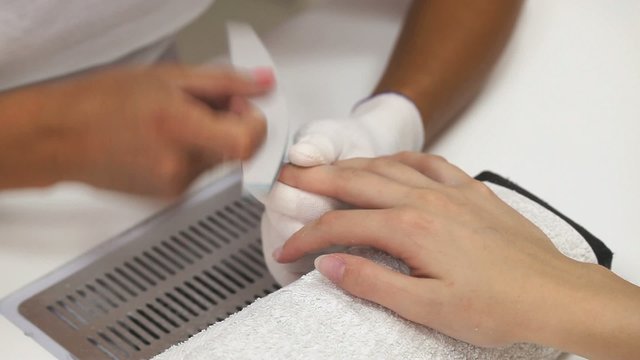 Finger nail treatment, sanding fingernails in beauty salon